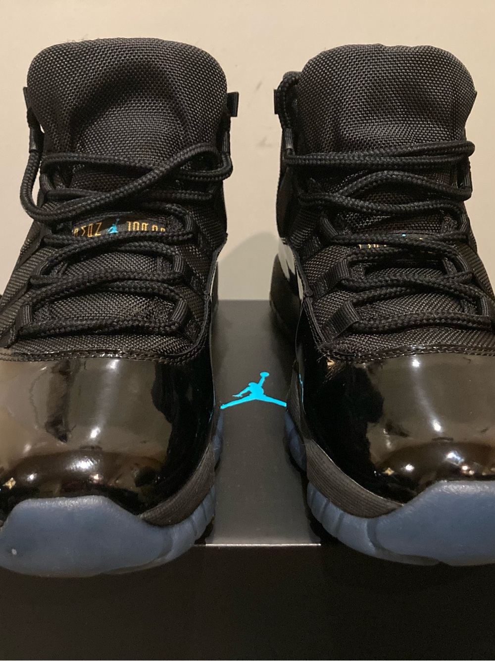 Jordan Men’s Retro 11 High-Top Sneakers in Black and Light Blue
